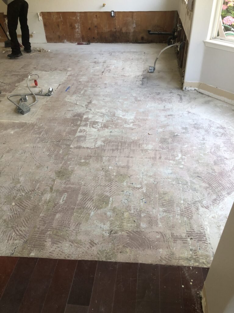 Flooring removed from a room during restoration work