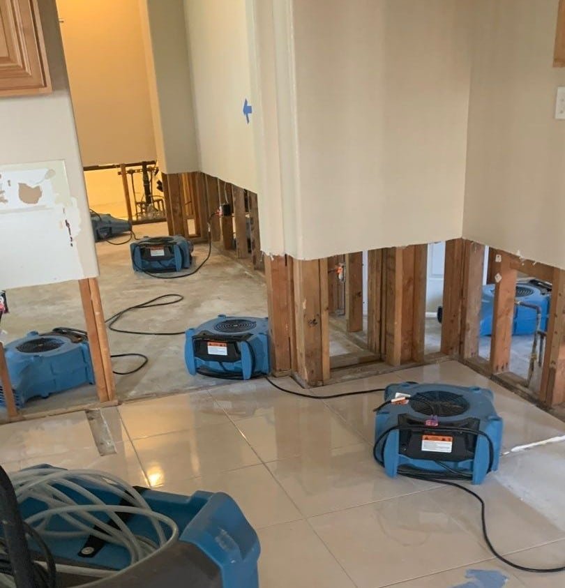 Air movers operating along opened lower wall sections