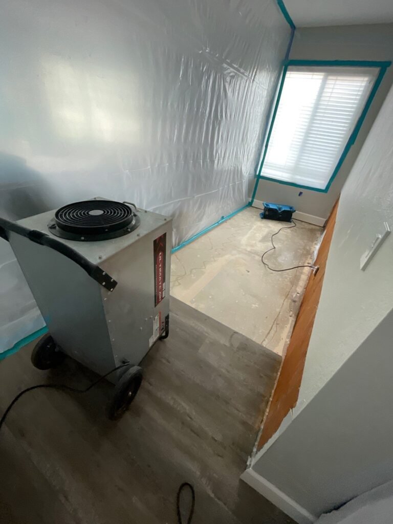 Drying equipment beside a contained interior work area