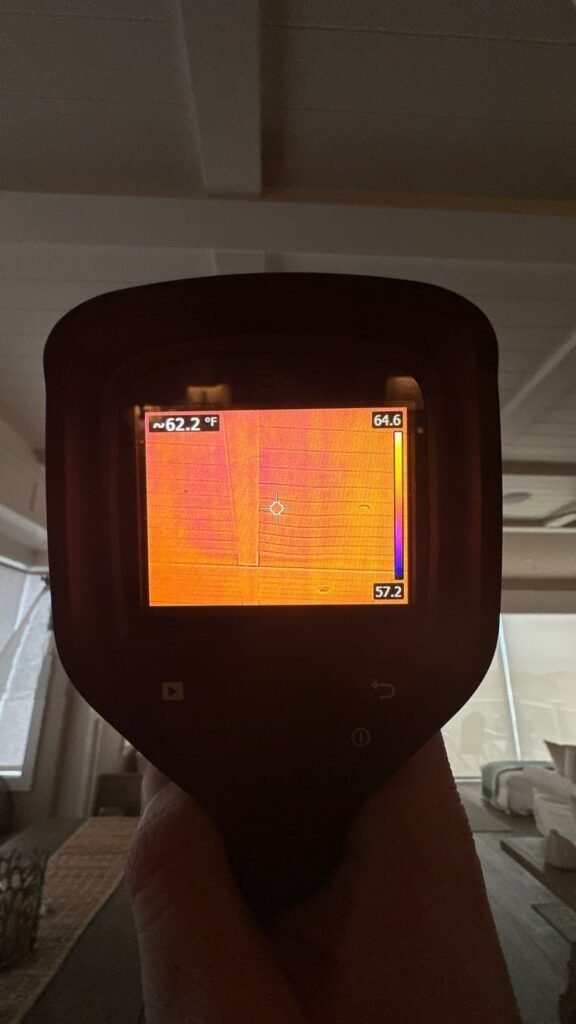 Thermal imaging camera used to inspect a wall surface