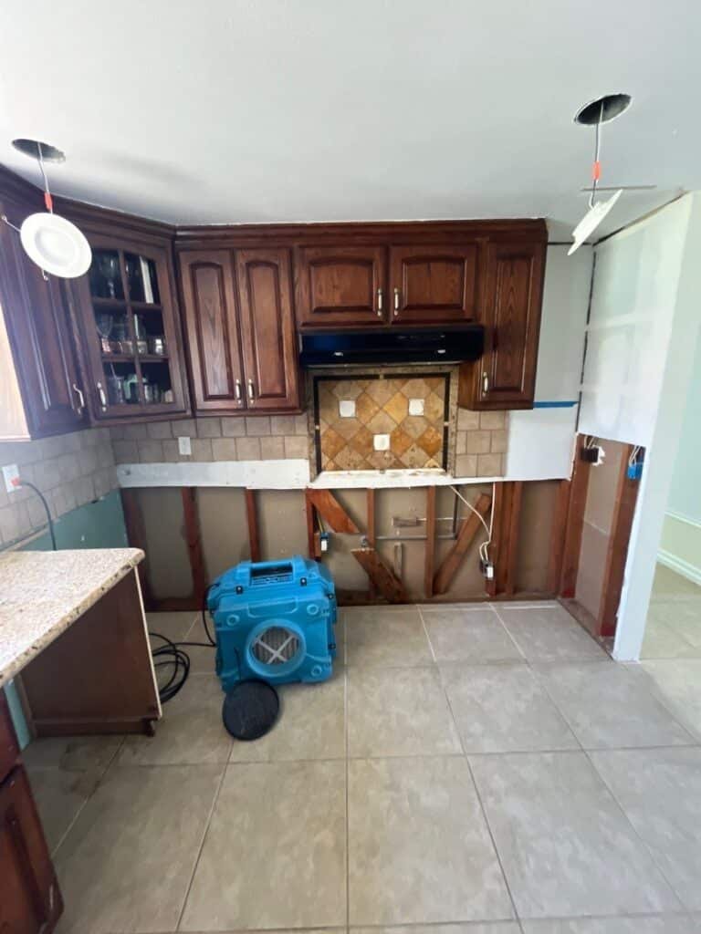 Drying equipment in a kitchen with lower cabinets removed