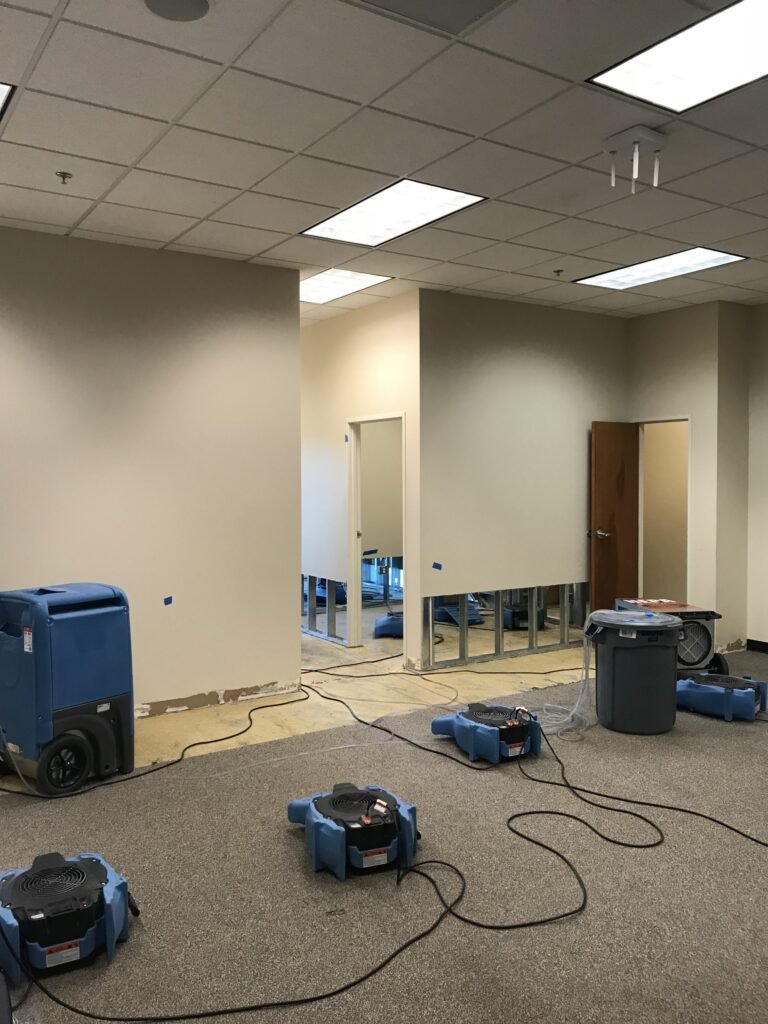 Drying equipment in an office with the lower wall covering removed