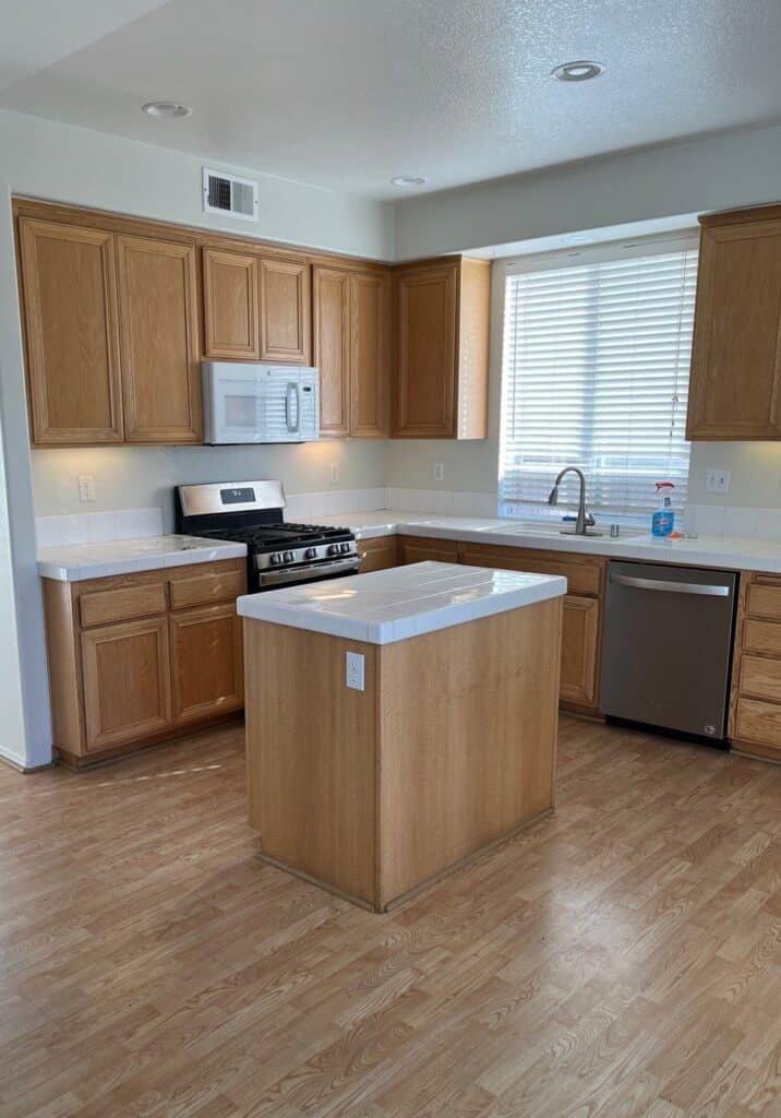 Kitchen cabinets and wood flooring shown in the project gallery