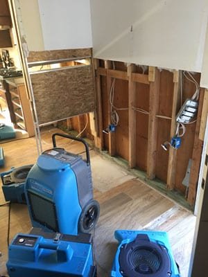 Drying equipment beside exposed kitchen wall framing — Santa Barbara