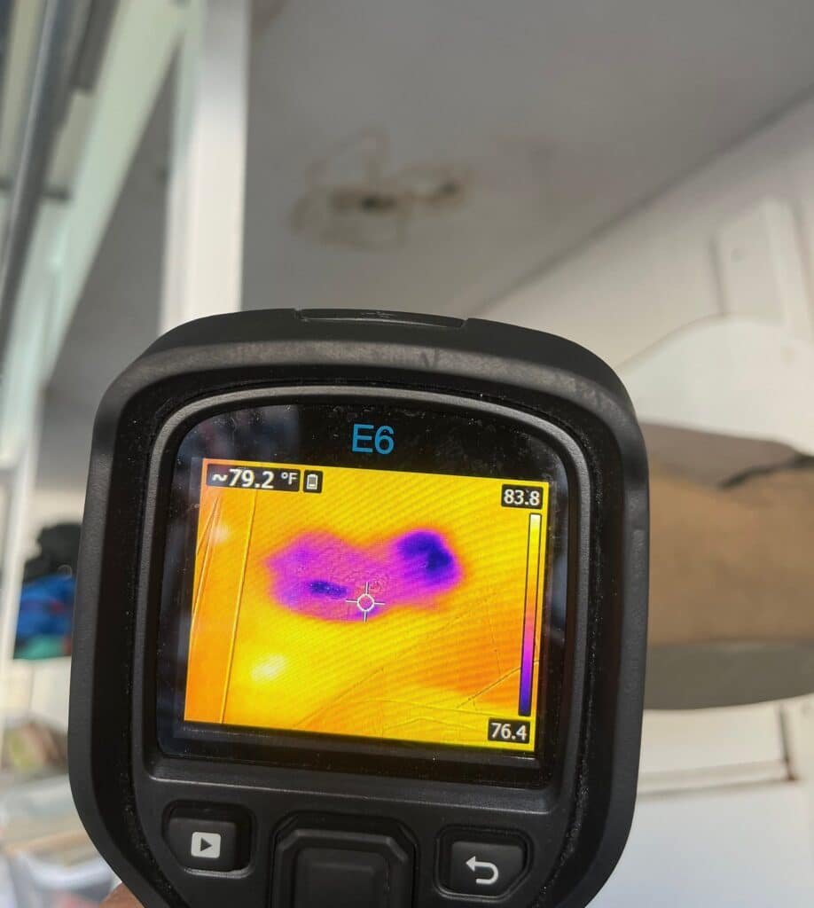 Thermal imaging camera inspecting a stained interior surface