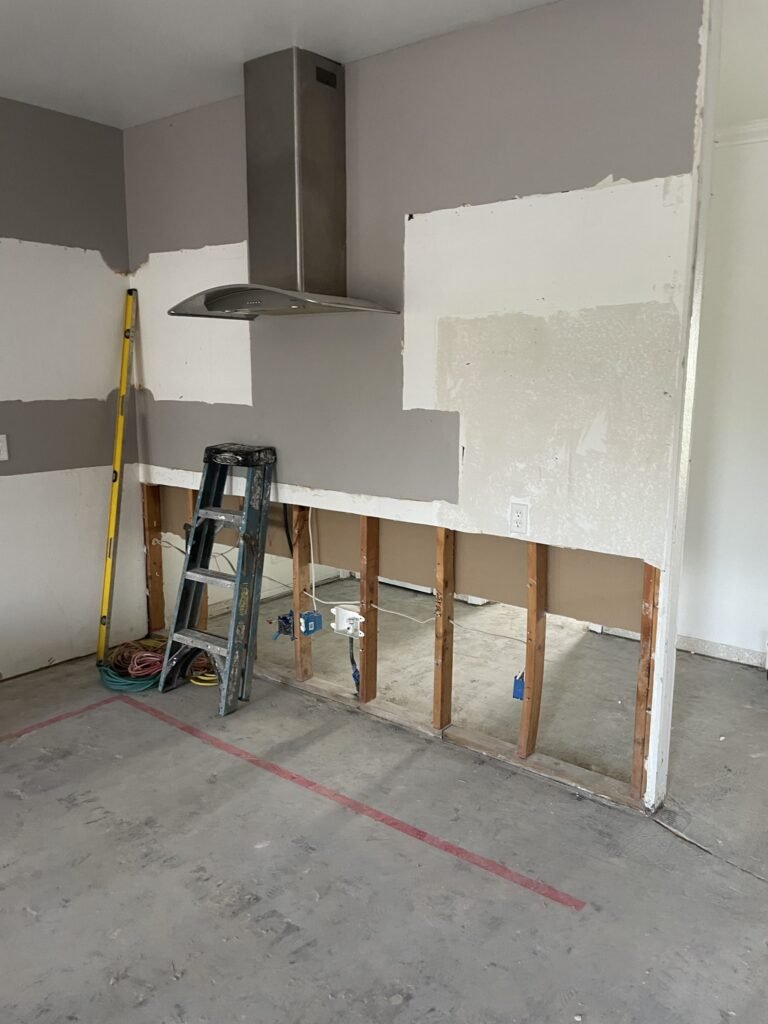 Lower wall sections removed to expose framing in a work area