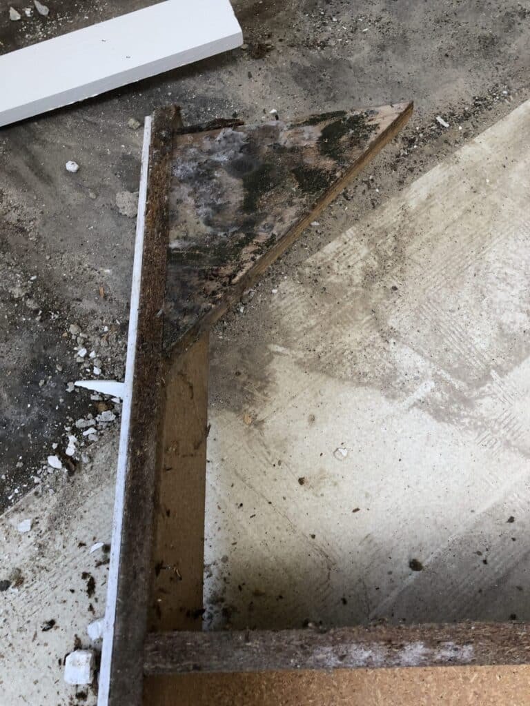 Discolored materials exposed beneath a countertop