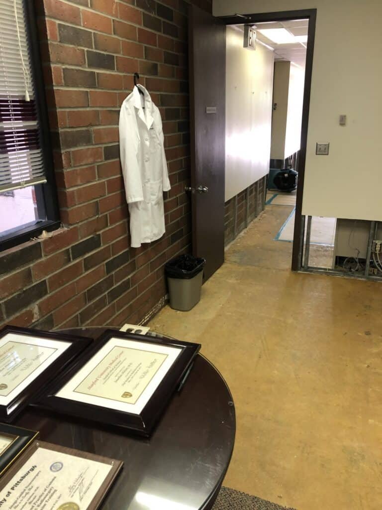 Commercial hallway with restoration equipment near a doorway — Thousand Oaks